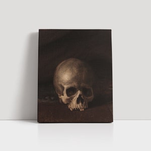 May include: A close-up of a human skull painted in a dark brown and beige color scheme. The skull is resting on a dark brown surface.