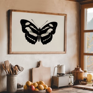 Dark academia wall art featuring black butterfly