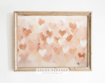 Puede incluir: Una pintura enmarcada con un fondo rosa claro y un patrón de corazones blancos y melocotón. La parte inferior del marco tiene el texto "ATLAS VINTAGE Arte vintage seleccionado".