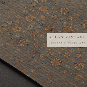 May include: A close-up of a vintage rug with a floral pattern in shades of gold, red, and blue. The rug has a textured surface and is made of a fine material. The text "ATLAS VINTAGE Curated Vintage Art" is printed on the rug.