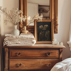 Spooky skeleton lovers embracing, framed by shadows.