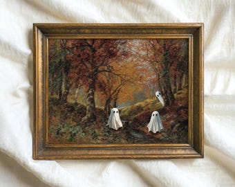 May include: A framed painting of a forest scene with autumn leaves in shades of red, orange, and yellow. Three white ghosts are floating in the forest.