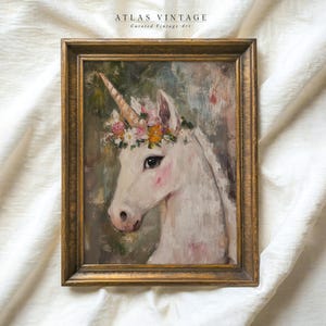 May include: A framed painting depicting a white unicorn with a floral crown. The unicorn's head and neck are visible, and the background is a soft green and blue.