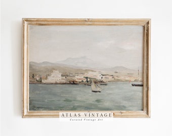 May include: A vintage painting in a light wood frame depicts a seascape with a town in the distance. The painting is in muted tones of blue, green, and brown. The text "ATLAS VINTAGE Curated Vintage Art" is at the bottom of the painting.