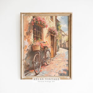 May include: A vintage painting of a bicycle parked in a narrow, cobblestone street in a European village. The bicycle is decorated with flowers and a basket. The buildings are painted in warm tones of yellow and orange, with red flower boxes hanging from the windows.