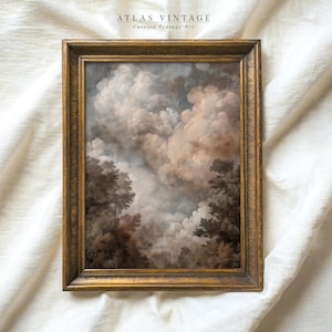 Puede incluir: Pintura de paisaje vintage enmarcada que presenta un cielo dramático con nubes arremolinadas en tonos de marrón, gris y blanco. La obra de arte está enmarcada en un marco dorado, con el texto "ATLAS VINTAGE Curated Vintage Art" en la parte superior.