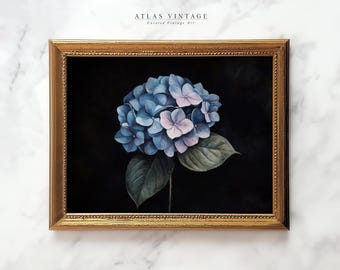 May include: A framed watercolor painting of a blue and purple hydrangea flower on a black background. The frame is gold with a decorative border.