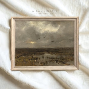 May include: A framed painting depicting a landscape with a cloudy sky and a flock of birds flying over a marsh. The painting is in a light wood frame.