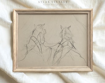May include: A framed black and white pencil sketch of two horses pulling a carriage. The sketch is on a beige background and is framed in a light wood frame.