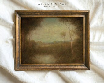 May include: A framed landscape painting depicting a forest scene with a river flowing through it. The painting is in a gold frame with a textured surface. The painting is titled "Atlas Vintage" with the text "Curated Vintage Art" below it.