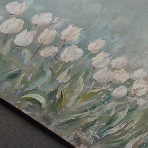 May include: Oil painting depicting white tulips in a field. The flowers are in full bloom with textured brushstrokes, set against a soft, light blue and green background. The artwork is on a canvas.