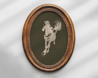 May include: A vintage oval frame with a dark green background and a white silhouette of a horse running. The frame is made of wood with a brown finish and ornate details.