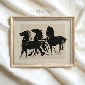 May include: A framed black and white print of three horses in a minimalist style. The print is on a beige background and has the text "ATLAS VINTAGE Curated Vintage Art" at the top.