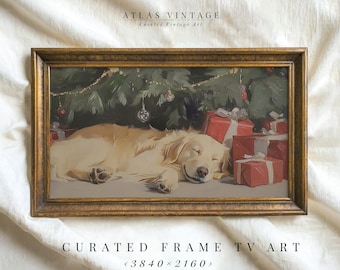 May include: A framed vintage painting depicts a sleeping golden retriever under a Christmas tree with red wrapped gifts. The frame is gold. The text "ATLAS VINTAGE" and "CURATED FRAME TV ART" are visible.