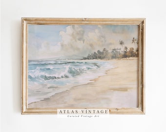 May include: A framed watercolor painting of a tropical beach scene with palm trees, blue ocean waves, and a sandy shore. The painting is in a light wood frame with the text "ATLAS VINTAGE Curated Vintage Art" at the bottom.