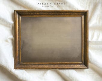 May include: A rectangular, vintage-style framed artwork with a gold-toned, ornate frame. The artwork features a muted, neutral color palette with a gradient effect. The text "ATLAS VINTAGE" and "Curated Vintage Art" is visible at the top.