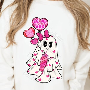 May include: A white ghost with pink hearts and a pink bow holding a pink and white heart-patterned cup with the text "Be My Boo" on a pink heart balloon.
