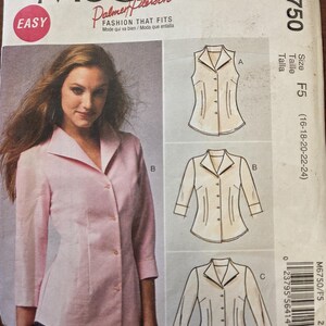 May include: McCall's sewing pattern M6750. The pattern features a woman wearing a pink button-down shirt. The pattern includes illustrations of shirt variations. The text "EASY" is in a red circle. The pattern size is F5 (16-18-20-22-24).