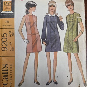 May include: Vintage McCall's printed sewing pattern for young junior/teen dresses. The pattern features three dress versions with different styles. The pattern is marked "Easy to Sew" and includes sizing information. The cover art shows illustrations of the dresses.