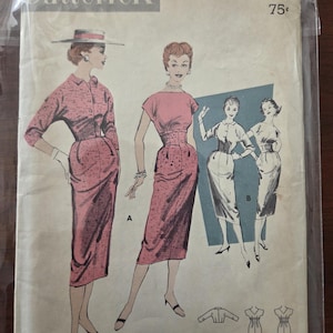 May include: Vintage Butterick printed sewing pattern, size 14, featuring illustrations of women's dresses. The cover art shows a pink dress with a fitted waist and a button-down design. The pattern includes multiple dress styles.