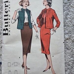 May include: Vintage Butterick Printed Patterns sewing pattern. The cover features illustrations of two women in stylish outfits. One model wears a teal plaid vest, white blouse, and brown skirt. The other model is in a red skirt suit. The pattern is size 14, bust 34.