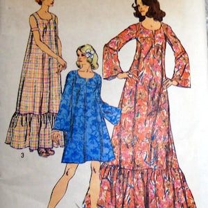 May include: Simplicity sewing pattern 5681 featuring three dress designs. The pattern includes a long floral dress, a blue dress, and a plaid dress. The pattern is marked with the price of $100.