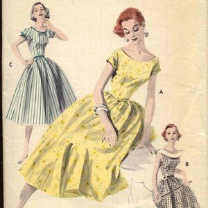 May include: Vintage Butterick sewing pattern featuring illustrations of three dresses. The dresses include a striped dress, a yellow floral dress, and a checkered dress. The pattern is labeled "Printed Patterns" and has the number 7709.