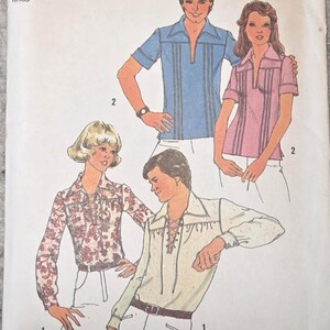 May include: Simplicity sewing pattern 6957. The pattern features illustrations of shirts with various designs. The top of the pattern is blue with the word "Simplicity" and the number "6957". The size is 12, bust 86 cm.
