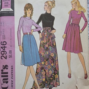 May include: Vintage McCall's 2946 sewing pattern for Misses' dresses. The illustration features three women in different dress styles, including a long skirt with a floral print and a short dress. The pattern includes the text "ADJUST -FOR- YOU*" and "MISSES' DRESS".