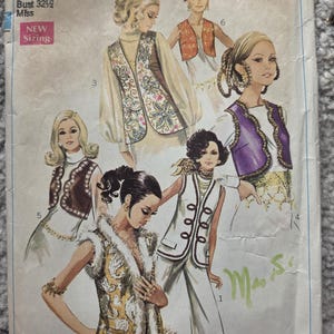 May include: A vintage Simplicity sewing pattern, number 8143, showcasing vest designs. The pattern is sized for a bust of 82.5 cm. The cover art displays fashion illustrations of the era, with the Simplicity logo prominently displayed.
