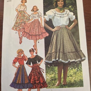 May include: Vintage Simplicity sewing pattern 7842, size 12 Miss. The pattern features illustrations of women's skirts and blouses in various styles. The cover has a retro design with the Simplicity logo and price.