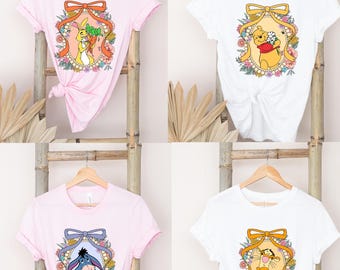 ティガーがイーヨーを抱きしめるくまのプーさんの T シャツ