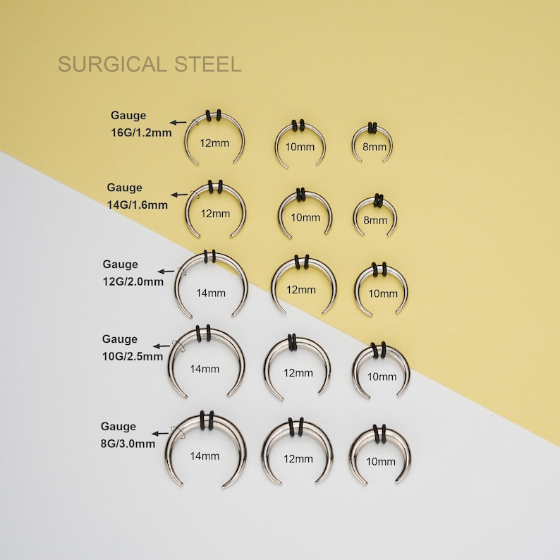 May include: Surgical steel nose rings in various sizes and gauges. The rings are silver in color and have a semi-circular shape. The sizes are 8mm, 10mm, 12mm, and 14mm. The gauges are 16G/1.2mm, 14G/1.6mm, 12G/2.0mm, 10G/2.5mm, and 8G/3.0mm.