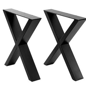 May include: Two black metal table legs in an X-shape design. The legs are made of a sturdy metal and have a matte finish. The top of each leg has pre-drilled holes for easy attachment to a tabletop. These legs are suitable for a variety of table sizes.