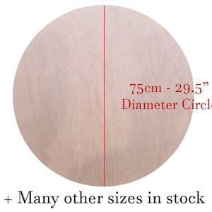 May include: A light wood circle with a diameter of 29.5 inches or 75 centimetres. The text "75cm - 29.5" Diameter Circle" is printed on the circle. The text "Many other sizes in stock" is printed below the circle.