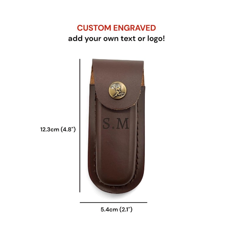 May include: A brown leather knife sheath with a brass emblem and the initials "S.M." The sheath is 4.8 inches long and 2.1 inches wide. Text at the top reads "CUSTOM ENGRAVED add your own text or logo!"