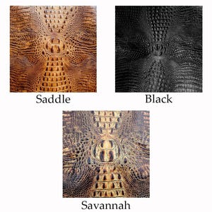 May include: Three samples of textured leather, each with a crocodile skin pattern. The colors are Saddle, Black, and Savannah. The names of the colors are written below each sample.