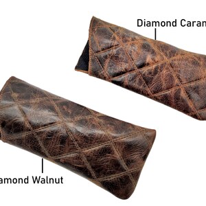 May include: Two leather eyeglass cases with a diamond quilted pattern. The case on the left is labelled "Diamond Walnut" and the case on the right is labelled "Diamond Caramel".