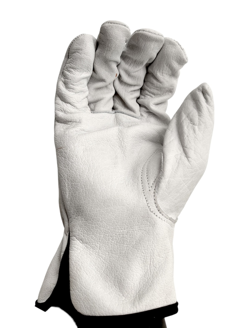 May include: White leather work gloves with a black cuff. The gloves have a textured surface and are designed for protection and durability.