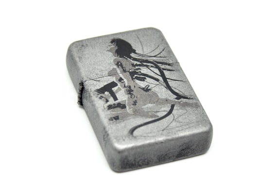 Flip Top Lighter in a Case With a Ghost in the Shell