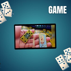 May include: Image features a collection of dominoes, with some scattered around a central image. The central image shows a hand holding a yellow domino with black dots and a SpongeBob SquarePants domino. The word "GAME" is displayed in white.