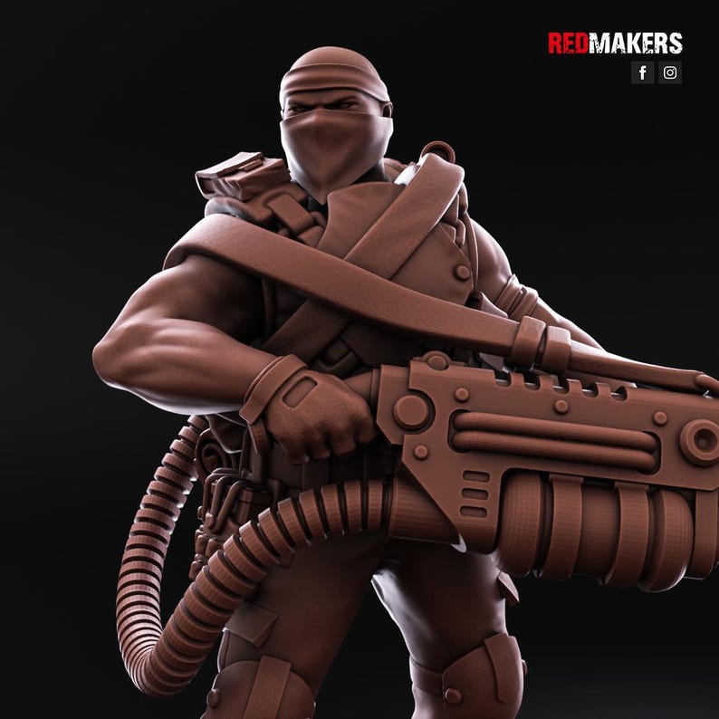 May include: A brown plastic miniature figure of a soldier wearing a black mask and holding a large, detailed, futuristic weapon.