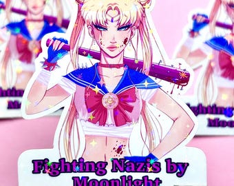 May include: A sticker featuring a cartoon anime character with blonde hair and a blue sailor uniform holding a baseball bat. The character has blood splattered on their face and clothing. The sticker has a glittery finish and the text "Fighting Nazis by Moonlight" at the bottom.