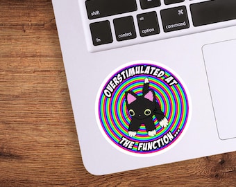 May include: A round sticker with a black cat in a rainbow spiral. The text reads "Over-stimulated at the function..."