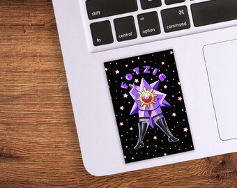 May include: A black sticker featuring a purple star-shaped figure with a red and gold center, wearing black boots and lingerie. The sticker has the word "FOTZIG" in purple text and white stars on a black background.