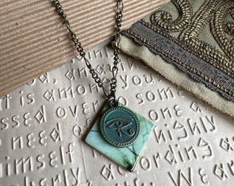 Brass Eye of Horus and Shell Jewelry - One of a kind - Nature inspired Jewelry with Charm on Adjustable Chain