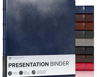 May include: A navy blue presentation binder with a textured cover and a white label featuring the text GALLERY LEATHER BAR HARBOR, MAINE PRESENTATION BINDER. The binder includes 10 sheets and 3 rings. A stack of additional binders in various colors is visible.