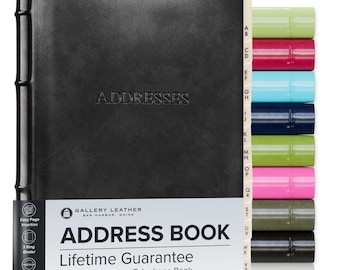 May include: A black address book with a three-ring binder mechanism and alphabetical tabs. The cover features the embossed word ADDRESSES. A white paper band displays the text GALLERY LEATHER, ADDRESS BOOK, and Lifetime Guarantee.