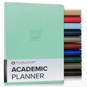 May include: A mint green academic planner with the years 2026 and 2027 embossed on the cover. A white band at the bottom displays the text Gallery Leather Bar Harbor, Maine Academic Planner. A stack of planners in various colors is visible.