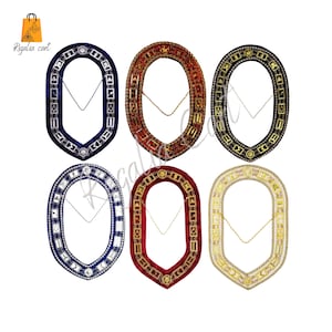May include: Six different Masonic collar jewels, each with a different color velvet backing and gold trim. The jewels are oval shaped and feature a variety of Masonic symbols. Each jewel has a chain attached.